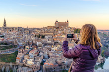 Woman Taking Pictures With Her Mobile Phone In Toledo