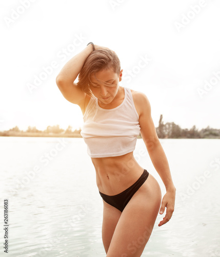Summer Beautiful Girl With A Short Haircut On The Beach