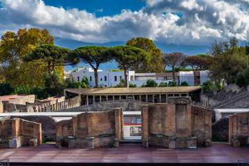 The antique scene of ancient amphitheater in Pompeii, Italy.