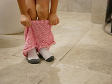 Selective Focus Of Little Baby's Short Pants Being Pulled Up By Herself After The Baby Finished Using A Toilet - Potty Trainning 