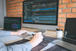 © Ngampol - Professional Developer programmer working a software website design and coding technology, writing codes and database in company office, Global cyber connection technology