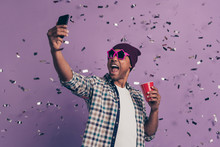Close Up Photo Portrait Of Screaming Carefree Handsome Positive With Red Plastic Glass Beverage In Hands Making Selfie On Device Isolated Glitter Sparkles Background