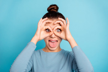 Wall Mural - Close up photo of cute lovely teen teenager have free time vacation rest relax fooling make faces ridiculous foolish see watch wear fashionable pullover isolated on blue background