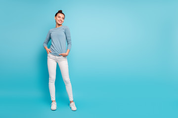 Canvas Print - Full length body size photo beautiful amazing she her lady stylish hairstyle look side empty space wondered toothy funky wear casual white pants sweater pullover isolated blue bright background