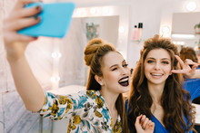 Stylish Portrait Two Stylish Attractive Models With Stylish Makeups, Luxury Coiffures Making Selfie In Hairdresser Salon. Friends Together, Having Fun, Expressing True Positive Emotions, Beauty