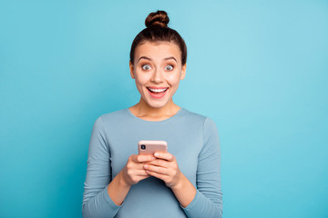 Canvas Print - Portrait of her she nice-looking cute charming attractive lovely cheerful cheery girlish glad girl holding in hands cell isolated over bright vivid shine turquoise background