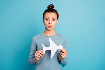 Wall Mural - Close up photo beautiful amazing she her lady sending air kiss relatives parents hands arms hold paper airplane going abroad friends wear casual sweater pullover isolated blue bright background