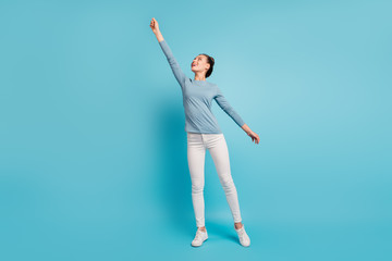 Wall Mural - Full length body size view photo cute pretty teen teenager try catch holiday feel content glad idea creative enjoy rejoice candid modern pullover white trousers sneakers isolated bright background