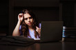 © Elnur - Young female student preparing for exams late at home