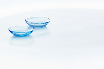 Contact lenses on light blue background. Eyewear, eyesight and vision, eye care and health, ophthalmology and optometry