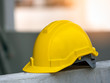 © Touch1976 - Construction safety concept, yellow hard safety helmet hat