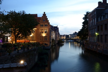 Night view of the river Leie with evening lighting and the cannon 