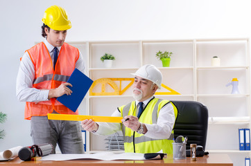 Two engineers colleagues working under project 