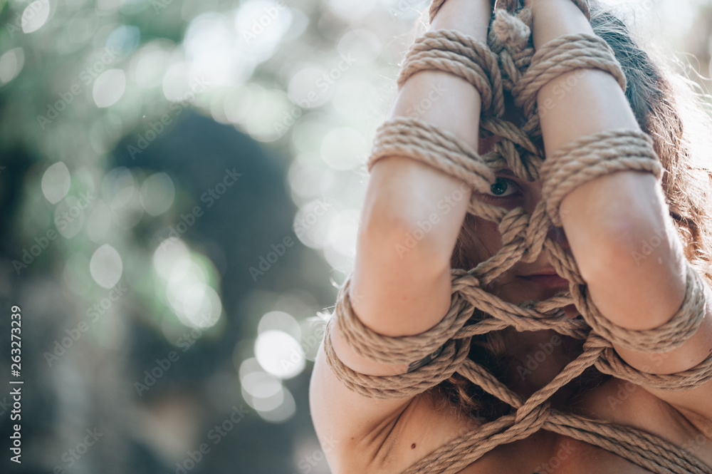 Bound Woman Woman bound with a rope in Japanese technique shibari outdoors Stock ...