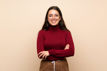 Wall Mural - teenager girl with glasses keeping the arms crossed in frontal position
