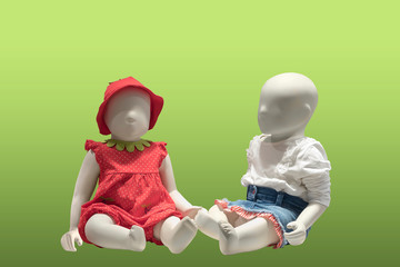 Two children mannequins.