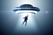 © Elnur - Flying saucer abducting young businessman
