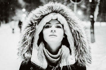 Wall Mural - girl in fur hood. black and white portrait, close-up