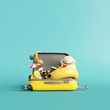 © aanbetta - Yellow suitcase with traveler accessories on blue background. summer travel concept. 3d rendering