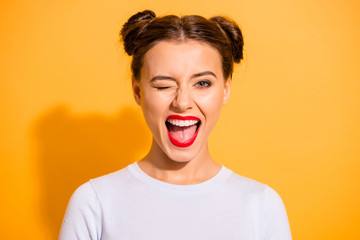 close up portrait of lovely cute funny lady making winks opening her mouth shouting yeah having holi
