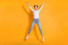 Full Length Body Size View Portrait Of Charming Isolated Dreamy Lady Jumping Like Star Touching Sky Wearing White Denim Clothing Pink Footwear Over Bright Background 