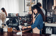 © weedezign - Asian Barista use tablet take order from customer in coffee shop,cafe owner writing drink order at counter bar,Food and drink business concept,Service mind concept.restaurant waiter worker