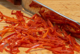 Fototapeta  - Chopped rawit chili pepper with a knife