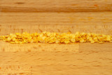 Fototapeta  - Row of chili seeds on a wooden board