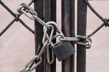 padlock with chain locks iron gates.