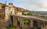 Fototapeta  - View of Bergamo with Porta San Giacomo gate, Sant Andrea platform of Venetian Walls at morning. Italy