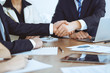 © rogerphoto - Business people shaking hands at meeting or negotiation in the office. Handshake concept. Partners are satisfied because signing contract