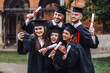 © Тарас Нагирняк - Portrait of multiracial graduates holding diploma and doing selfie on phone! Lifestule!