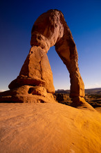 A Wide-angle Perspective Of Famous Delicate Arch In Arches National Park Near Moab Utah. The Glorious Blue Sky Creates A Perfect Complimented Color Contrast Against The Orange Sandstone Formation