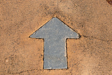 Black Painting In Forward Direction Arrow Symbol On Brown Concrete Road Background
