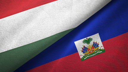 Hungary and Haiti two flags textile cloth, fabric texture