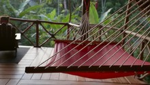 Slow Motion: Hammock Hanging In Open, Thatched Building Among Tropical Trees In El Limon, Dominican Republic