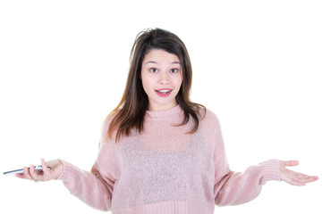 Wall Mural - Beautiful confused young woman with phone in hand looking camera isolated on white wall background in studio portrait