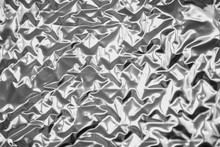 Blurred Abstract Smooth Crumpled Silver Aluminum Foil Background Texture