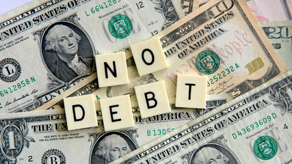 No Debt message with a background of American dollar notes.