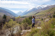 © Alwih - Young girl on the background of spring mountains. Beautiful mountain gorge. Nature and adventure.