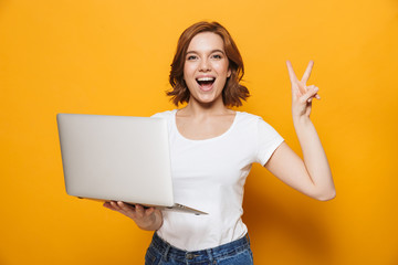 Portrait of a happy lovely girl standing isolated