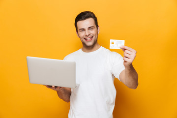 Wall Mural - Portrait of a happy handsome man wearing t-shirt