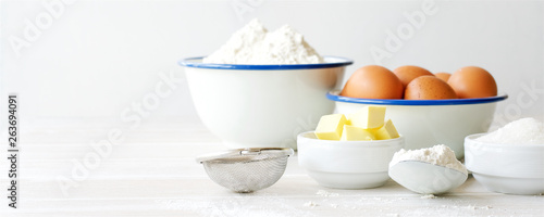 Cuadros en Lienzo Ingredients for making dough, dessert on white wooden table