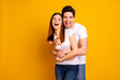© deagreez - Portrait of his he her she two nice lovely attractive cheerful cheery positive people cuddling laughter pointing at you choose choice isolated over vivid shine bright yellow background