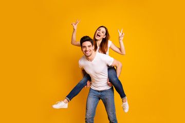 Sticker - Portrait of his he her she two nice lovely charming attractive playful cheerful positive people showing double v-sign having fun isolated over vivid shine bright yellow background