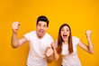© deagreez - Portrait of two nice attractive lovely charming cheerful cheery ecstatic overjoyed people having fun good mood best lucky attainment isolated over vivid shine bright yellow background
