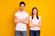 © deagreez - Close up photo beautiful cheer she her he him his pair stand side teamwork self-confident professionals specialists work job reliable workers wear casual white t-shirts isolated yellow background