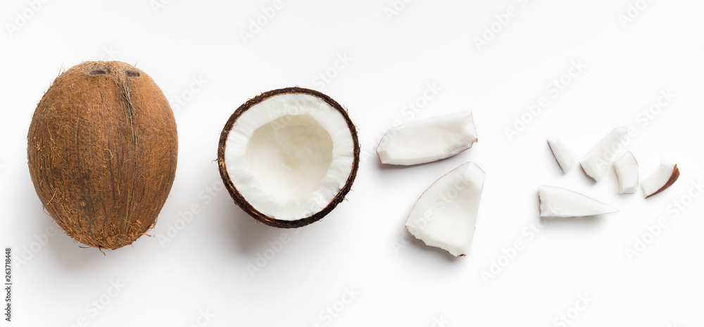 Pieces of coconut on white - obrazy, fototapety, plakaty 