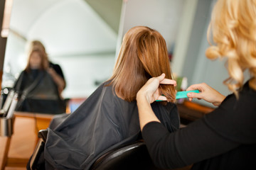 Wall Mural - Red-Haired Girl Getting Haircut in Hair Salon