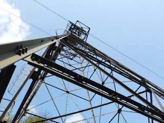 The pylon of the cableway that connects the towns of Albino and Selvino. Green painted pylons to camouflage them in the woods